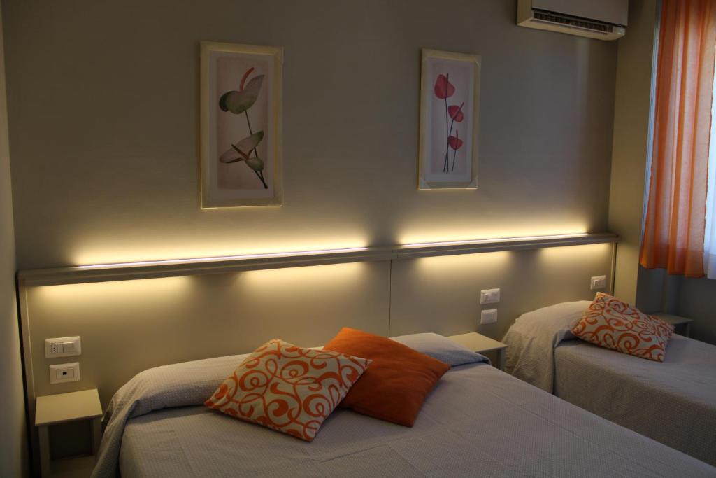 Postel nebo postele na pokoji v ubytování Hotel Delfina