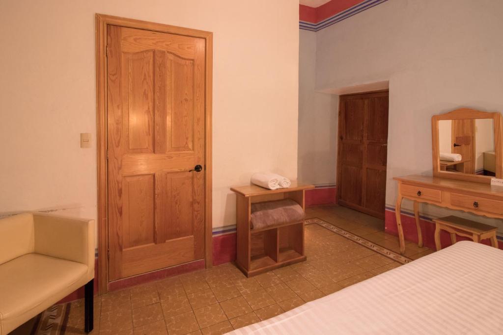 Postel nebo postele na pokoji v ubytování Hotel Meson Cuevano