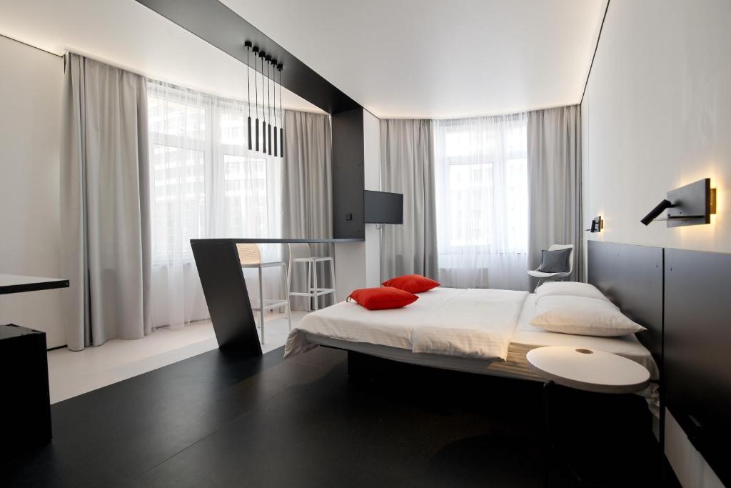 Кровать или кровати в номере Atmosfera Hotel