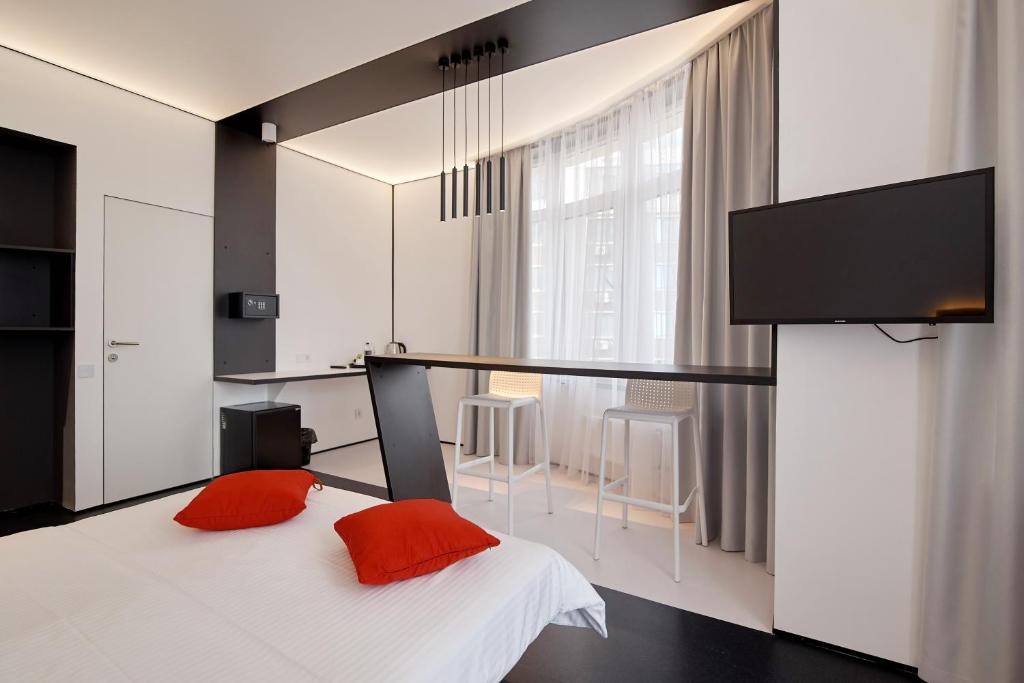 Postel nebo postele na pokoji v ubytování Atmosfera Hotel