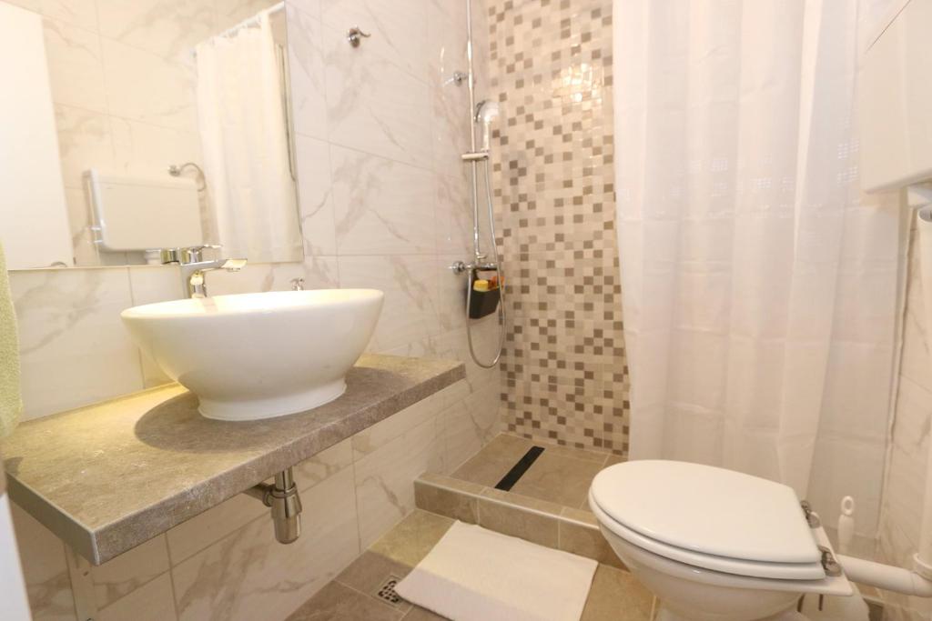 Koupelna v ubytování Rooms Bambina