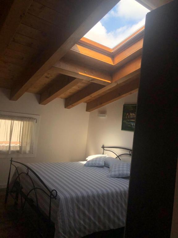 Postel nebo postele na pokoji v ubytování B&B Stella Alpina