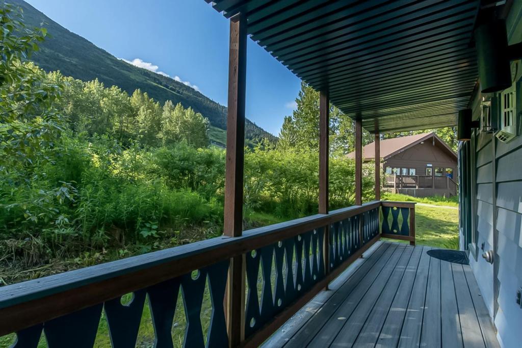 a porch with a view of the mountains at Alyeska Retreat C110 in Girdwood