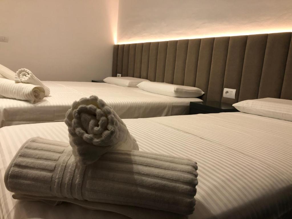 Postel nebo postele na pokoji v ubytování Hotel Tatzati 2
