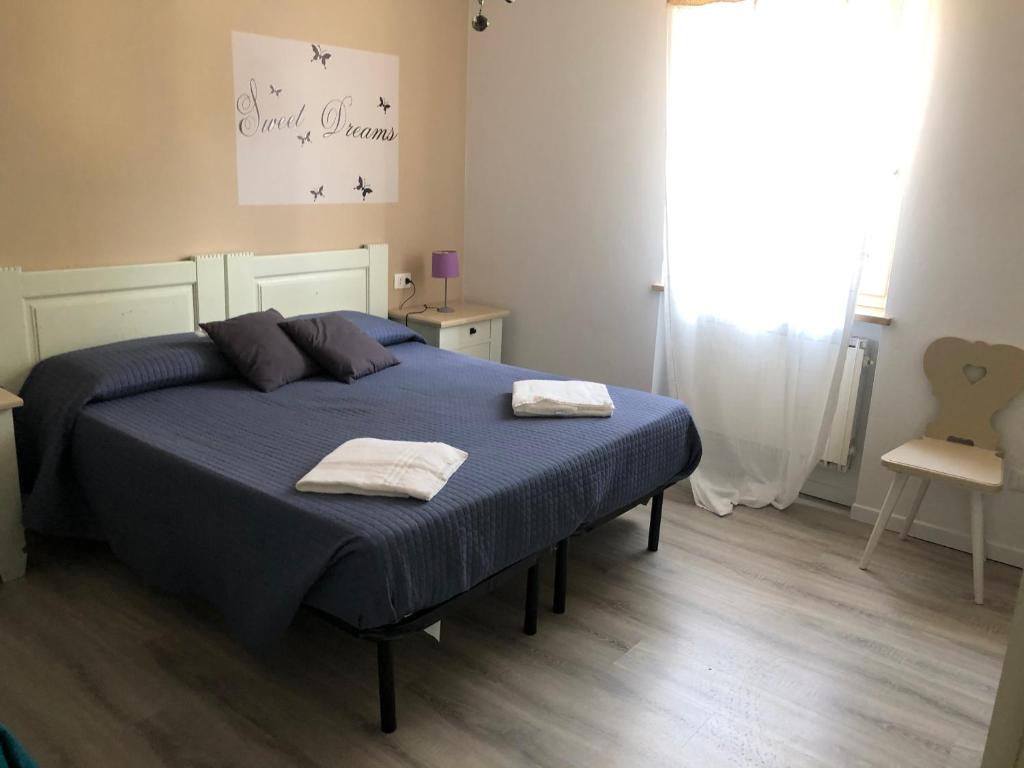 Letto o letti in una camera di B&B Corte del Garda