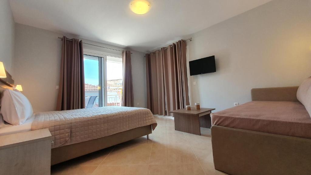 Posteľ alebo postele v izbe v ubytovaní Vasiliki House