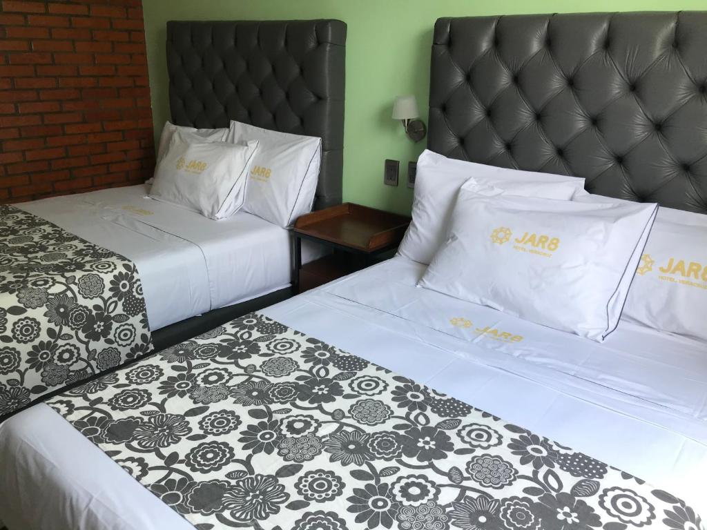 Postel nebo postele na pokoji v ubytování Hotel Jar8 Acuario enfrente al Acuario de Veracruz