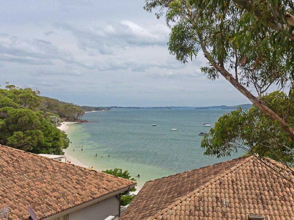 a view of a beach with boats in the water at Sebastapol, 4,66 Thurlow Avenue - Unit with wonderful views across the bay in Nelson Bay