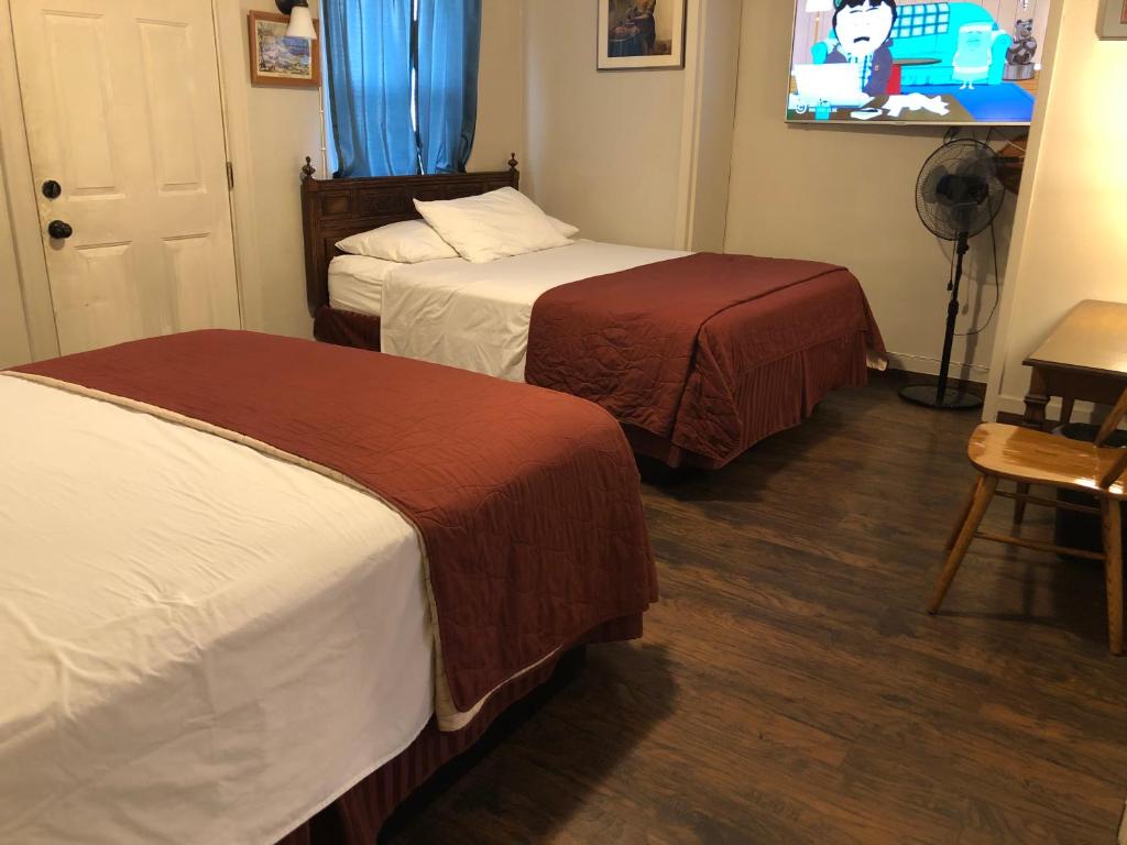 Postel nebo postele na pokoji v ubytování Angeles Motel