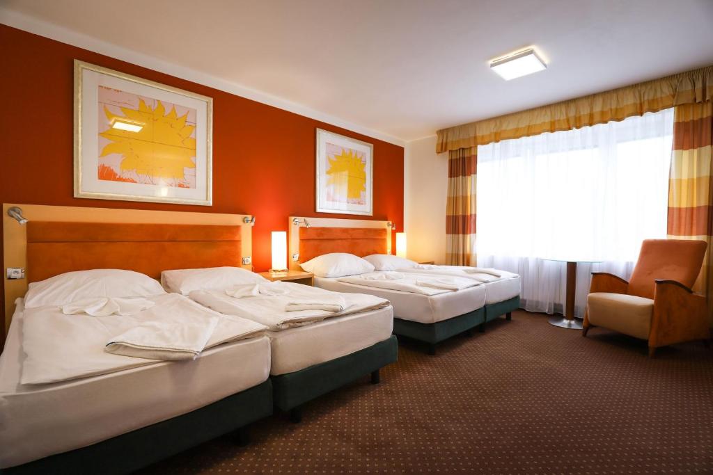 Postel nebo postele na pokoji v ubytování Active & Wellness Hotel Subterra