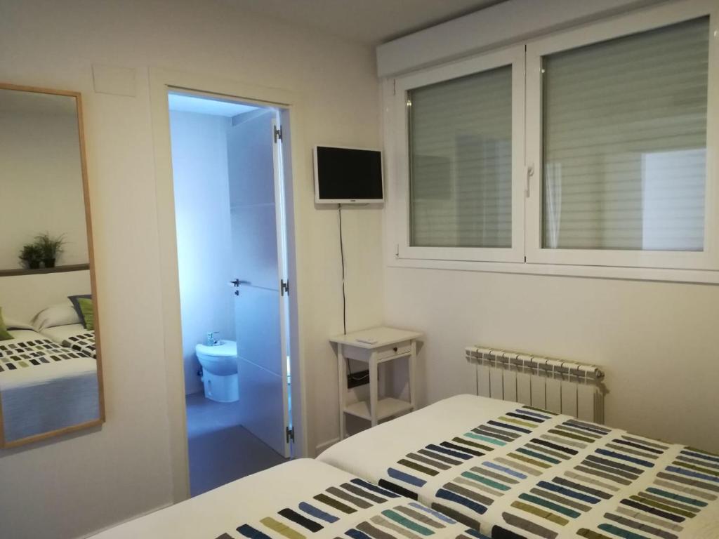 Postel nebo postele na pokoji v ubytování Calafell Espriu 2