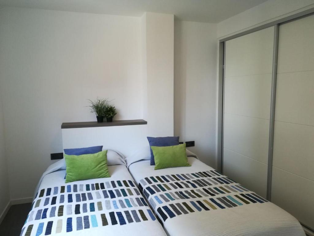 Postel nebo postele na pokoji v ubytování Calafell Espriu 2