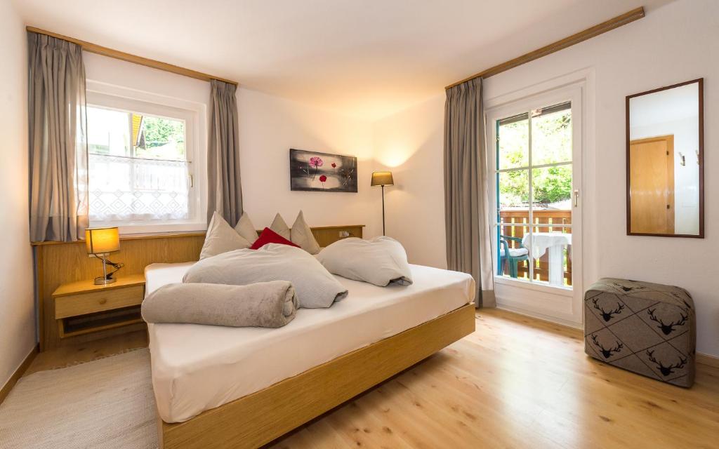 Postel nebo postele na pokoji v ubytování Haus Claudia B&B