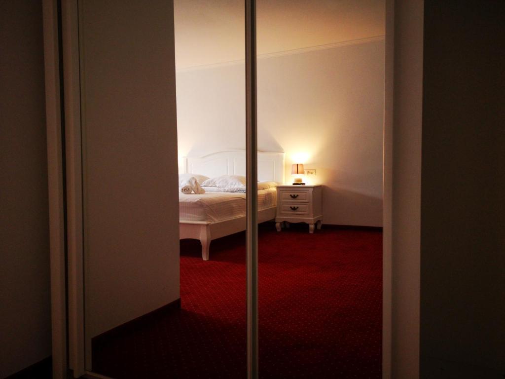 Postel nebo postele na pokoji v ubytování Casa Ardeleana