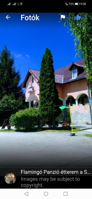 a picture of a house withfamilies panels afternoon as images may be subject at Flamingó Étterem Szálláshely in Somlójenő
