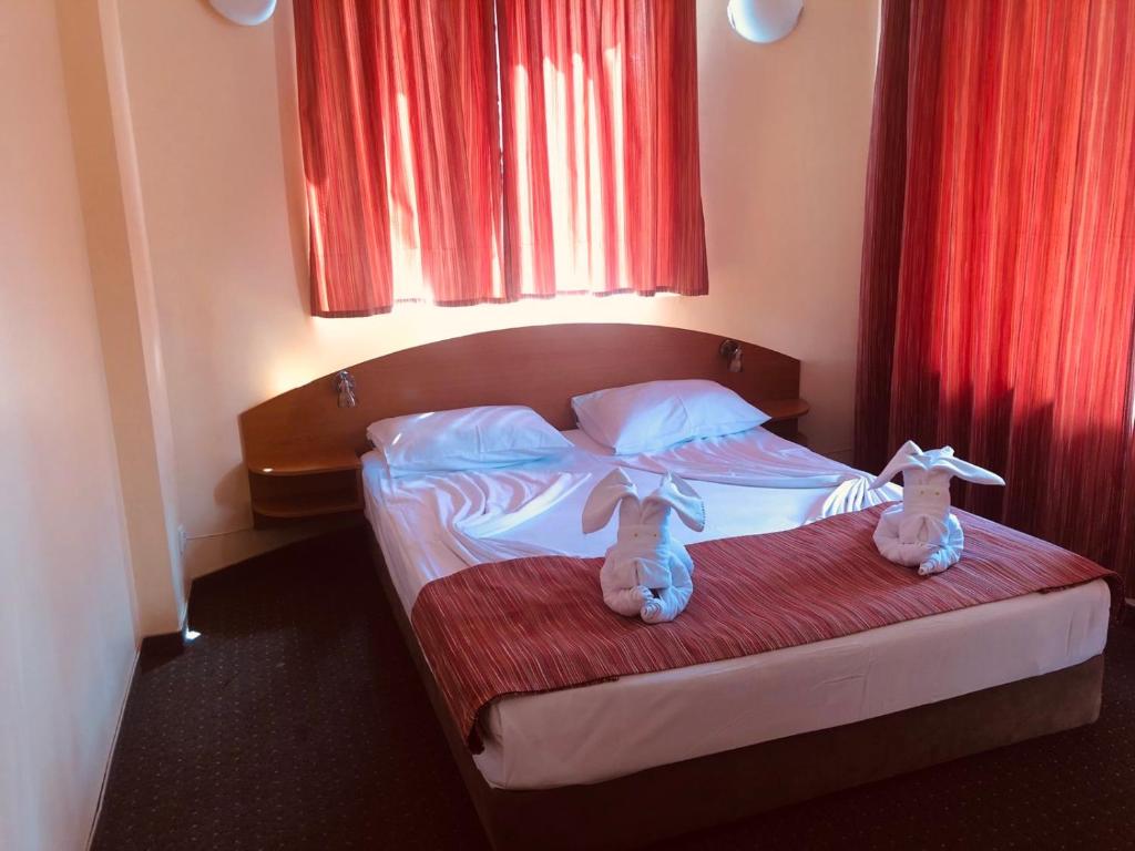 Postel nebo postele na pokoji v ubytování Family Hotel Deja Vu