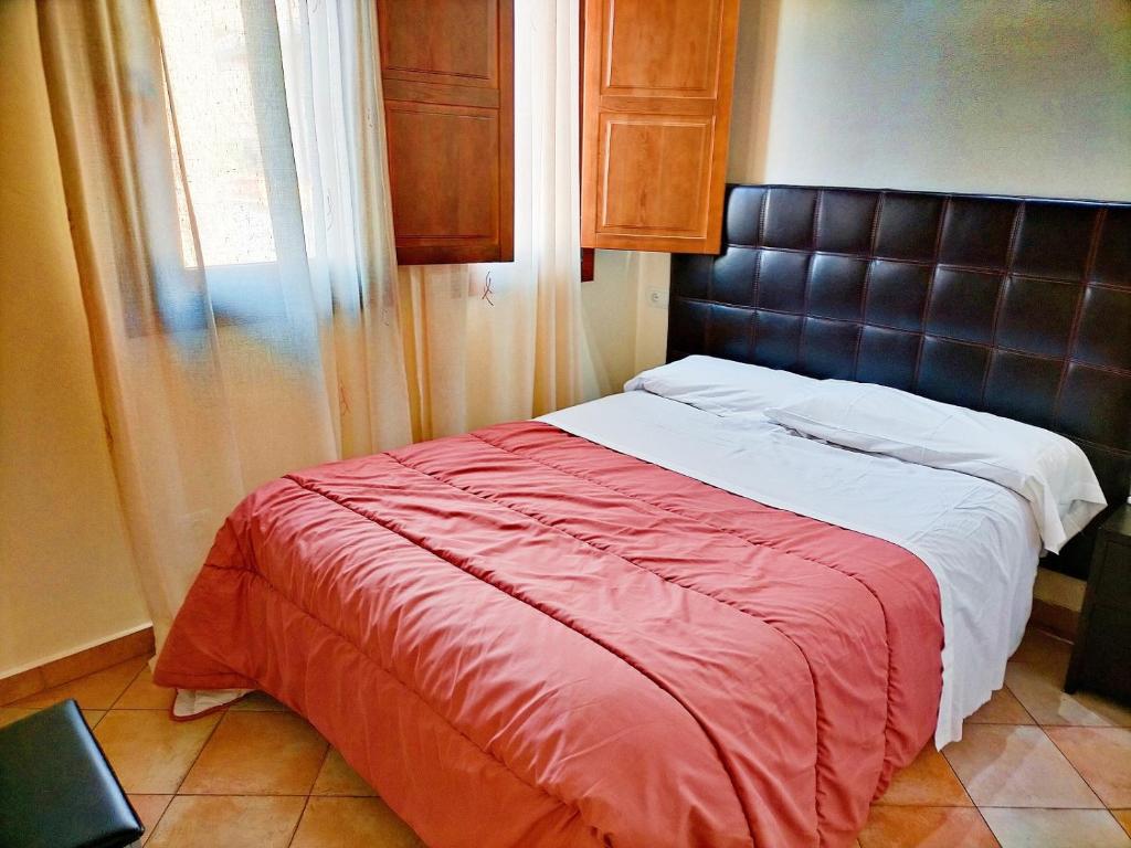 Postel nebo postele na pokoji v ubytování Abadia Suites