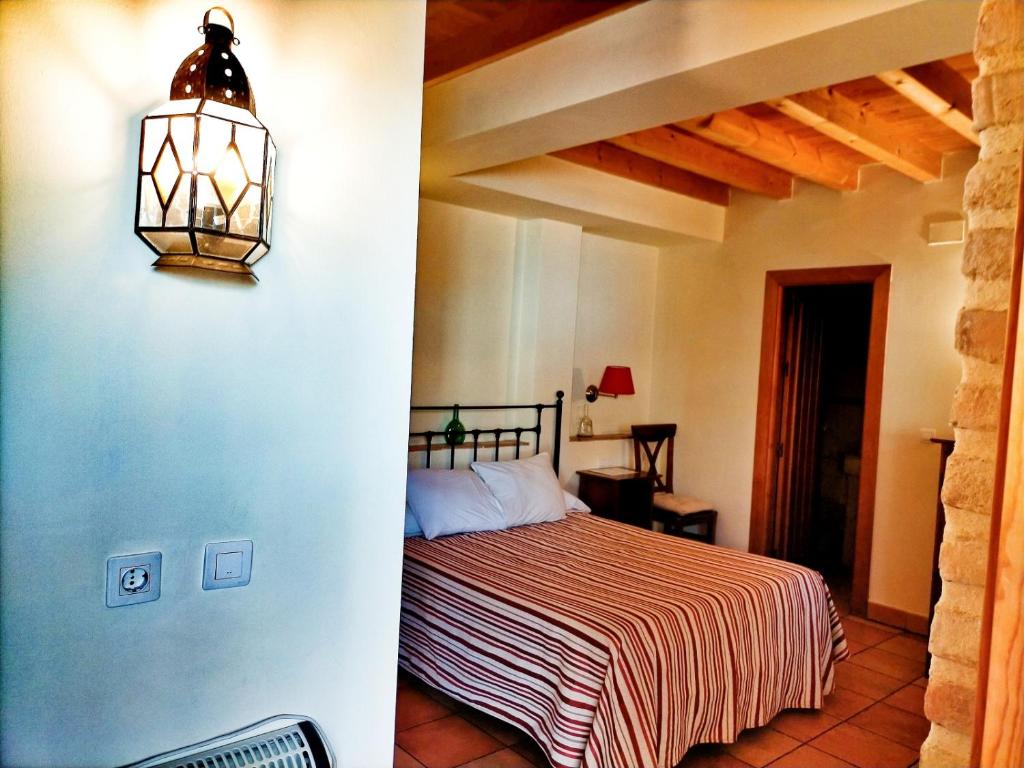 Cama o camas de una habitación en Abadía Hotel