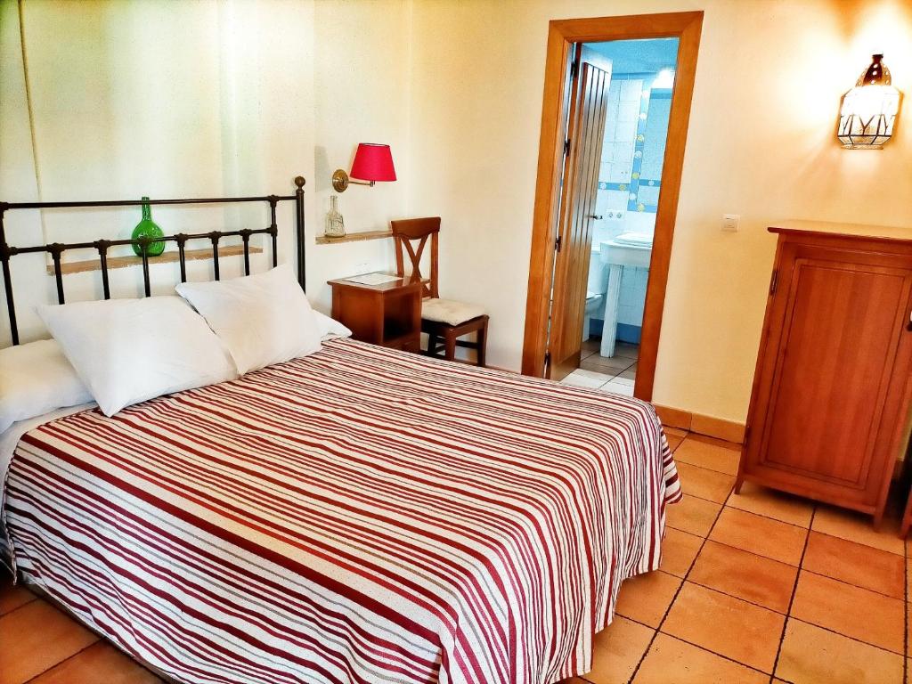 Cama o camas de una habitación en Abadía Hotel
