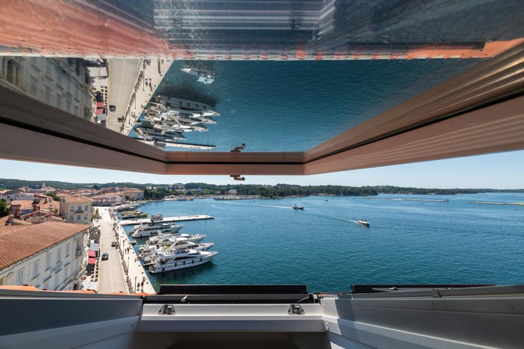 a view of a harbor with boats in the water at BO Hotel Palazzo in Poreč