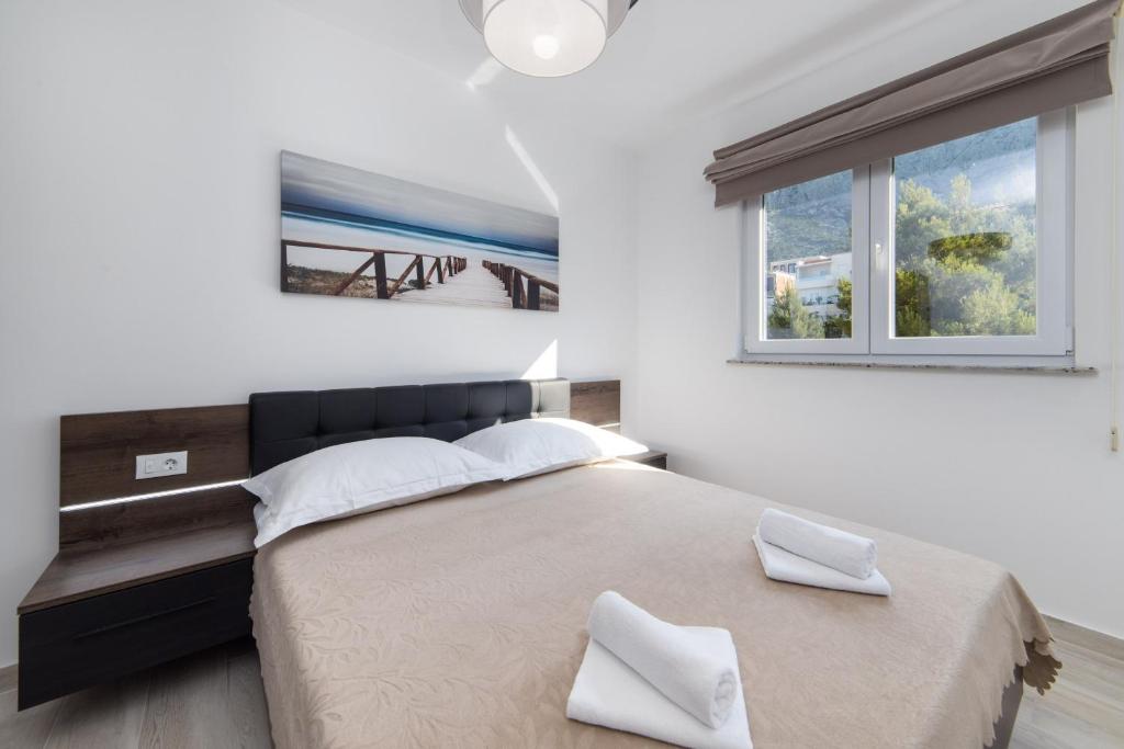Posteľ alebo postele v izbe v ubytovaní Apartments Blanka House