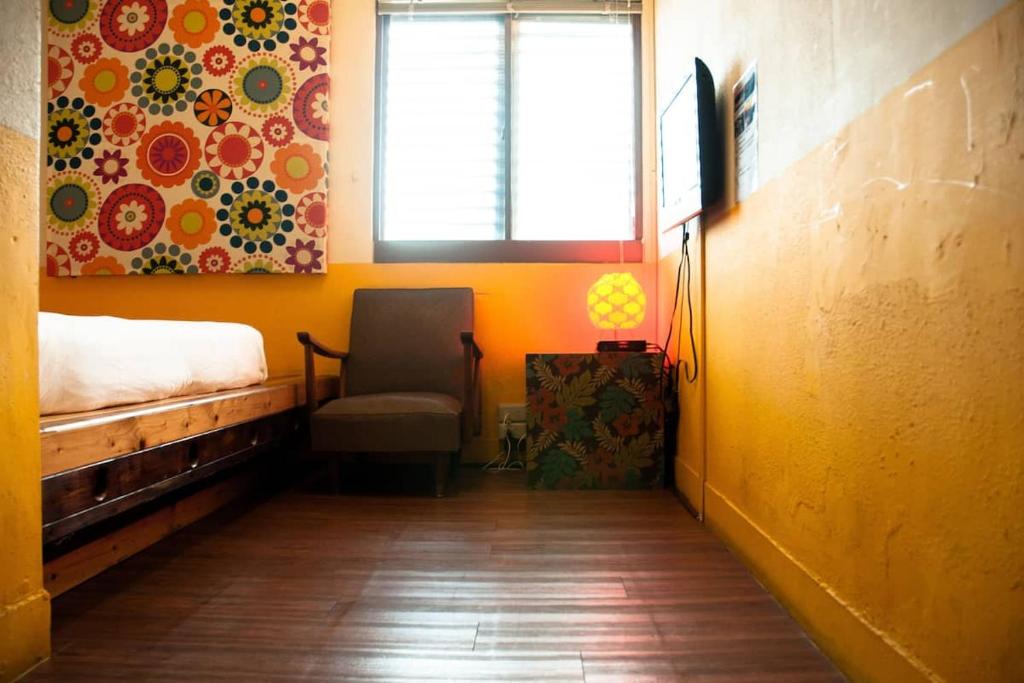 Postel nebo postele na pokoji v ubytování Heng-zhan Inn