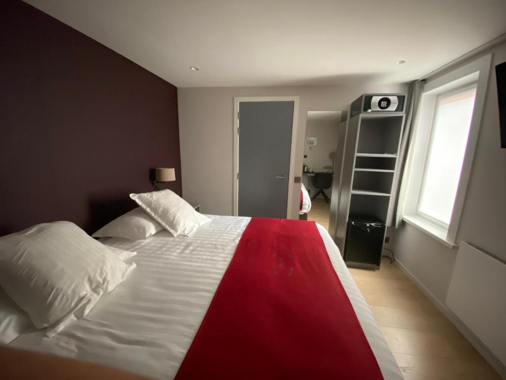 Postel nebo postele na pokoji v ubytování Hotel New Regina