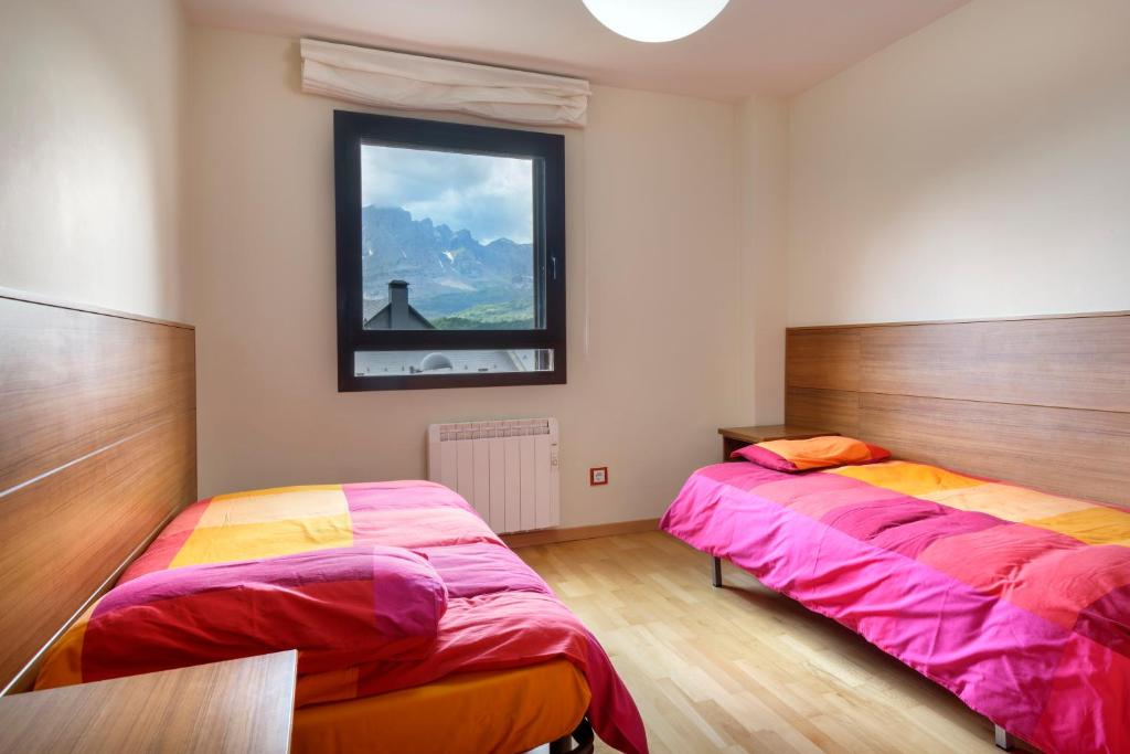 Postel nebo postele na pokoji v ubytování Peña Sabocos, apartamento turístico Panticosa