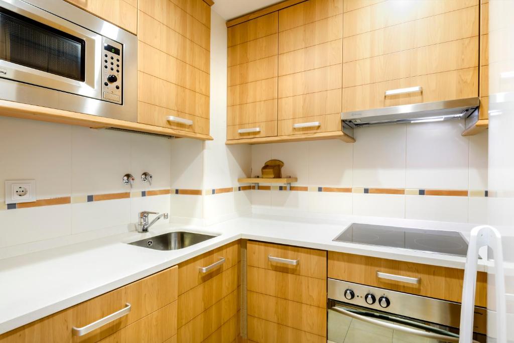 Kuchyň nebo kuchyňský kout v ubytování Peña Sabocos, apartamento turístico Panticosa