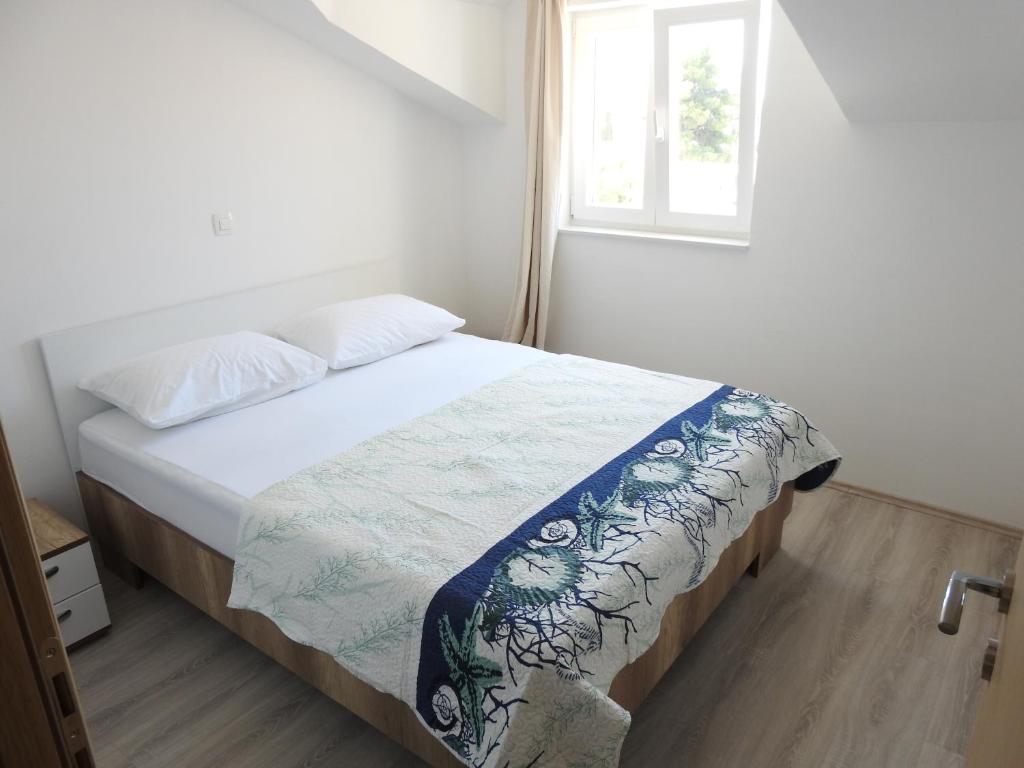Posteľ alebo postele v izbe v ubytovaní Apartmani Hrvoje Klarić - Srima
