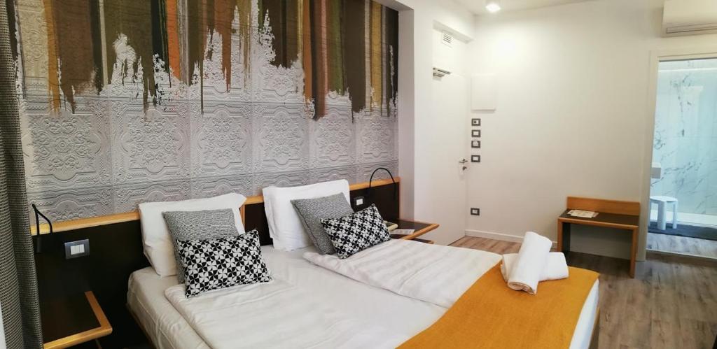 a living room with a couch with pillows on it at Hotel Belvedere in Venice-Lido