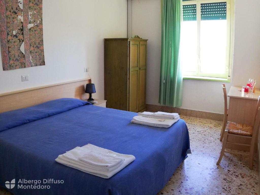 Posteľ alebo postele v izbe v ubytovaní Hotel Diffuso Montedoro