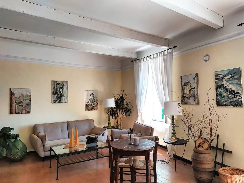 a living room with a couch and a table at L'Antico Borgo B&B in Levanto