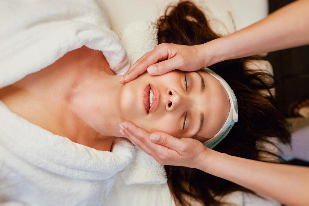 a woman getting her face groomed by a massage therapist at Rodos Park in Rhodes Town