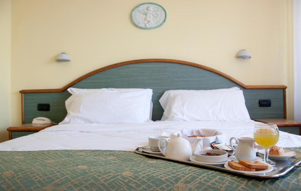 Postel nebo postele na pokoji v ubytování Hotel Europa