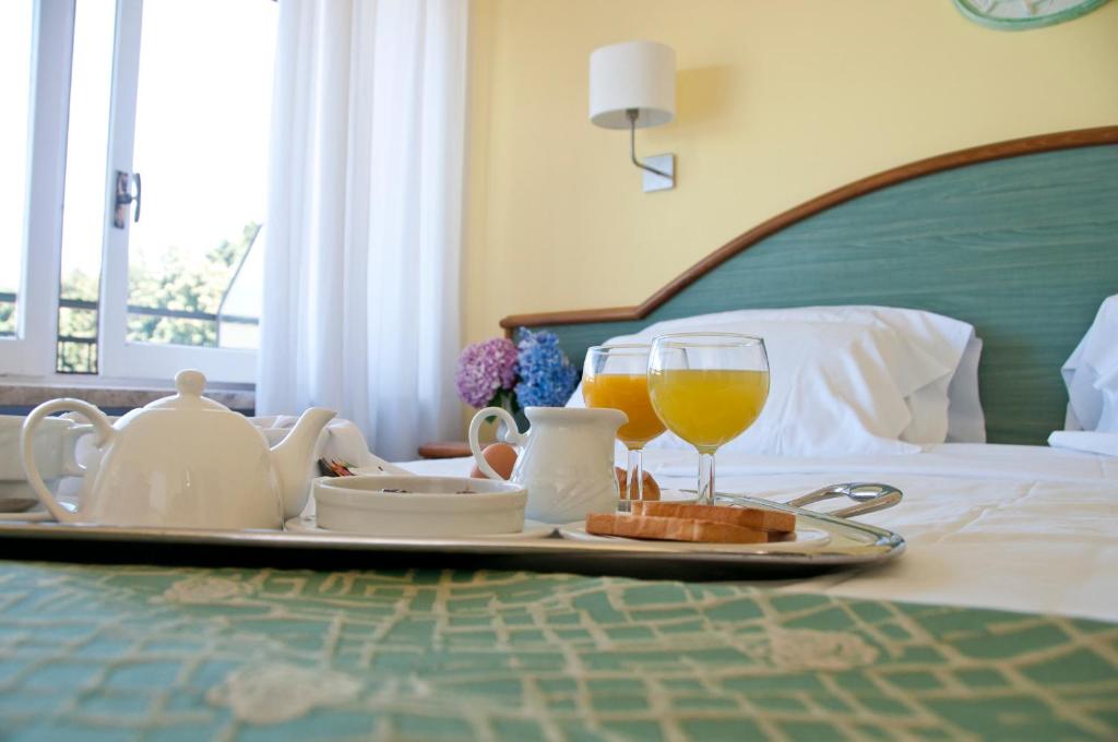 Postel nebo postele na pokoji v ubytování Hotel Europa