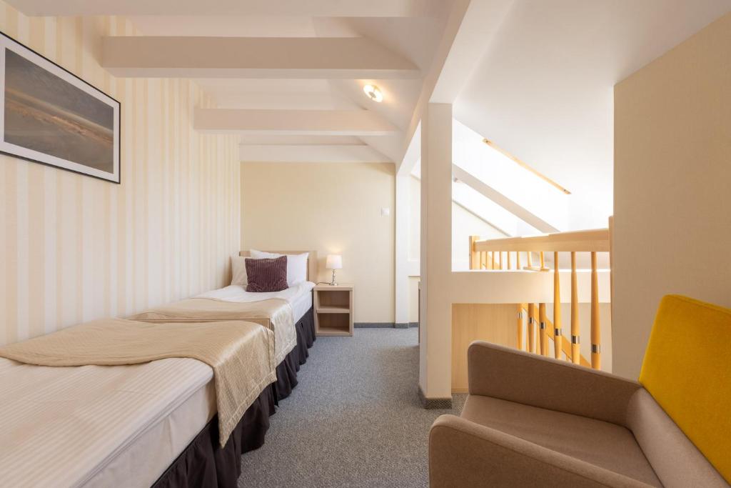 Postel nebo postele na pokoji v ubytování Hotel Jan
