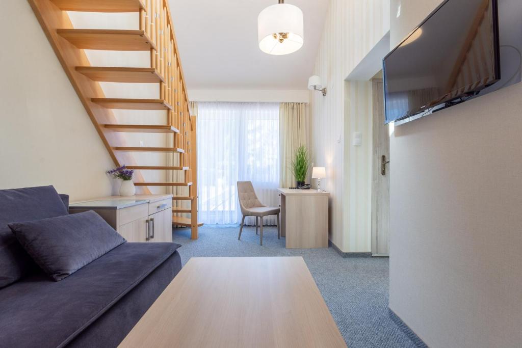 TV a/nebo společenská místnost v ubytování Hotel Jan