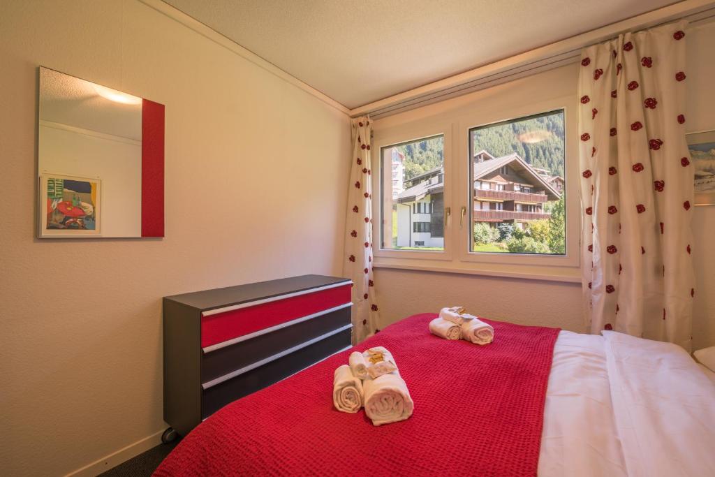 Postel nebo postele na pokoji v ubytování Chalet Primula Penthouse