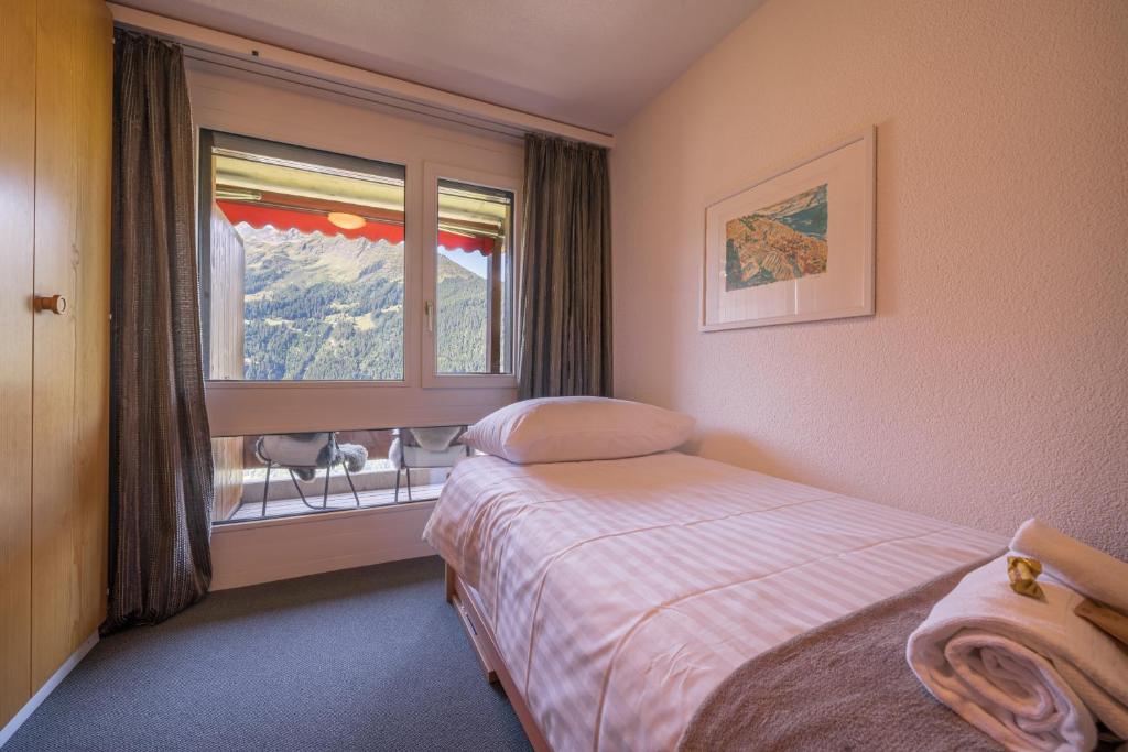 Postel nebo postele na pokoji v ubytování Chalet Primula Penthouse
