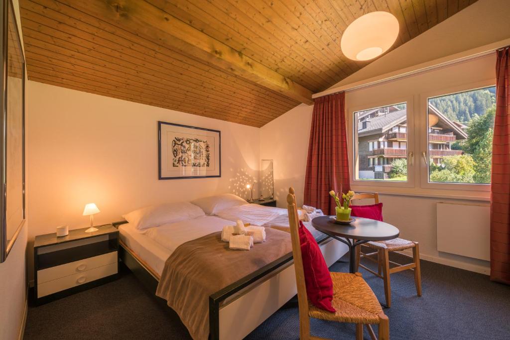 Postel nebo postele na pokoji v ubytování Chalet Primula Penthouse