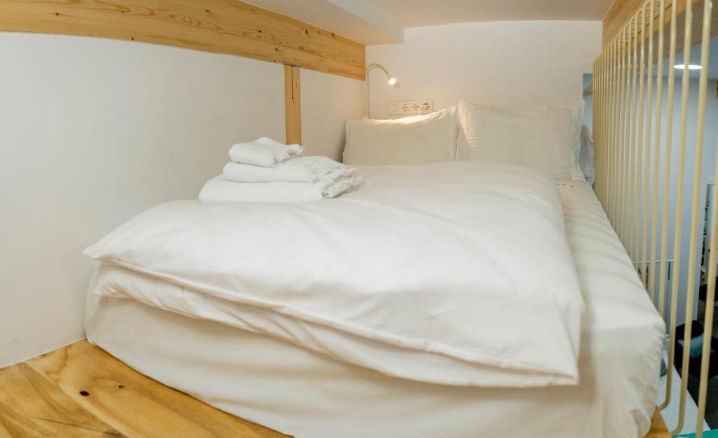 A bed or beds in a room at SanTelmo27A