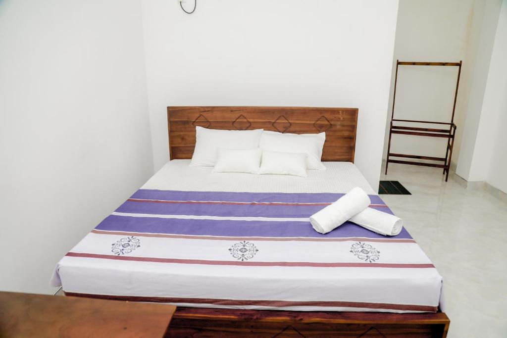 Postel nebo postele na pokoji v ubytování Araliya Lagoon Park Resort