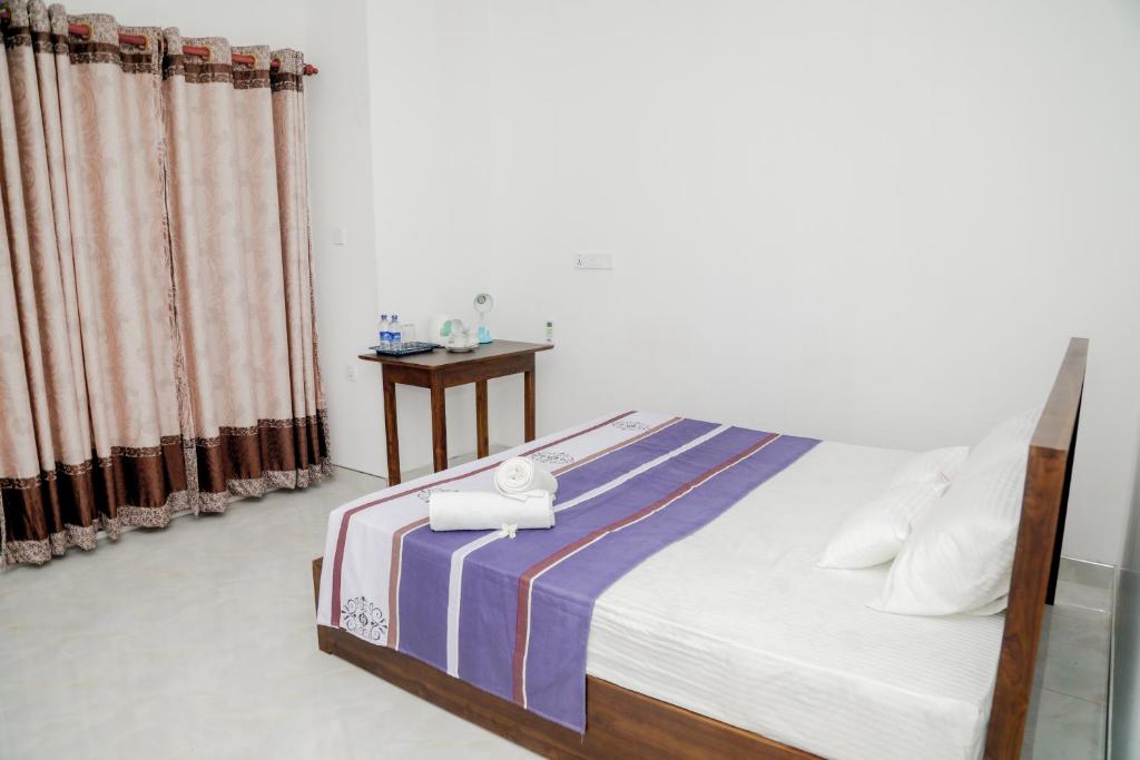 Postel nebo postele na pokoji v ubytování Araliya Lagoon Park Resort