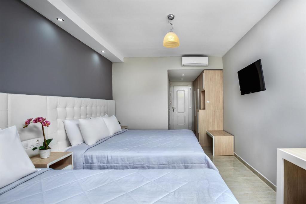 Postel nebo postele na pokoji v ubytování Anna Hotel