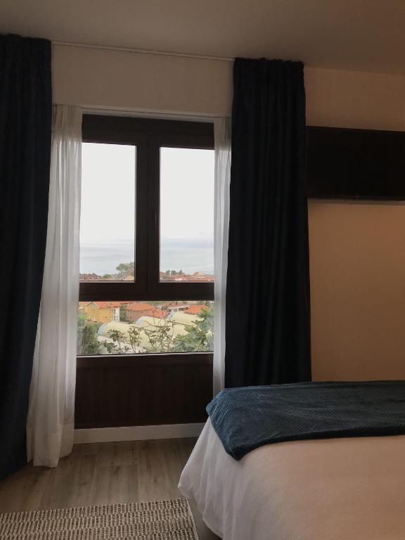 Postel nebo postele na pokoji v ubytování Finca El Palomar de Luanco