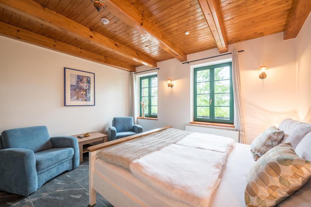 Postel nebo postele na pokoji v ubytování Vinařství Vrátil - penzion