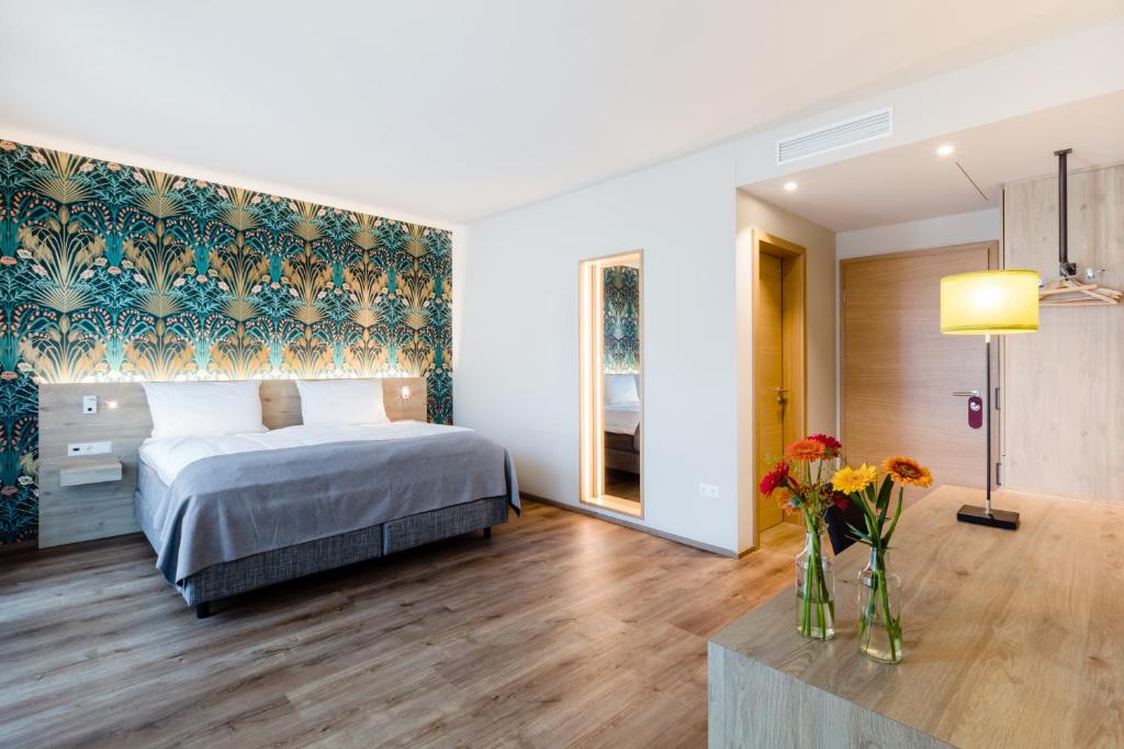 Postel nebo postele na pokoji v ubytování Hotel Martha