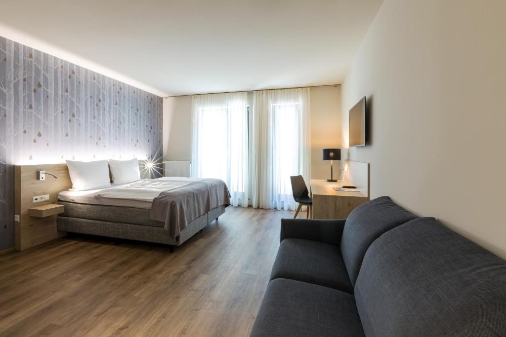 Postel nebo postele na pokoji v ubytování Hotel Martha