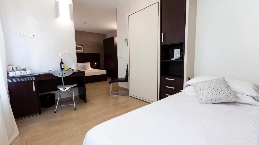 Postel nebo postele na pokoji v ubytování Hotel Lis